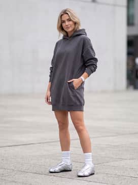 Taekwondo F50 Shoes – An oversized charcoal grey hoodie worn as a dress with white sporty crew socks to create a balanced, edgy, and comfortable athleisure look.