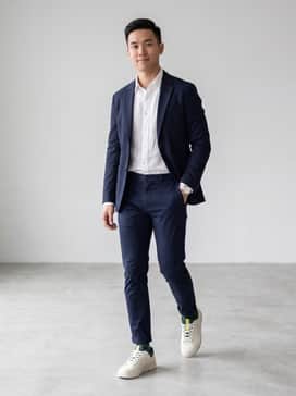Pair with slim-fit navy chinos, a tucked-in white linen shirt, and a lightweight navy blazer for a sophisticated business-casual ensemble.