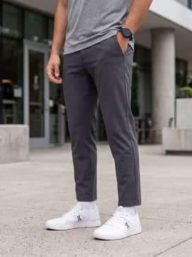 The Roger Clubhouse Pro – Light-wash straight-leg jeans paired with a high-quality heavyweight white t-shirt and an unbuttoned olive overshirt.