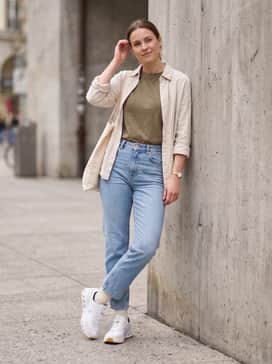 Style with light-wash straight-leg jeans, a tucked-in oversized graphic t-shirt in earth tones, and a canvas tote for a relaxed weekend vibe.