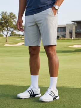 Tour360 24 Wide Golf Shoes – Light grey tailored tech shorts and a charcoal heathered quarter-zip pullover for a cool morning tee time.