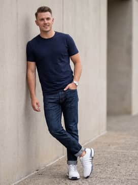 Tour360 25 Spikeless Golf Shoes – Style with dark-wash tapered jeans and a simple navy crewneck t-shirt for a sharp yet relaxed weekend outfit.