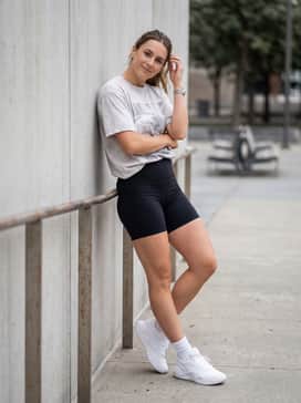 Ua Ace Low 2 – Black high-performance biker shorts styled with a vintage-wash oversized graphic t-shirt and white crew socks to emphasize the shoe's chunky silhouette.
