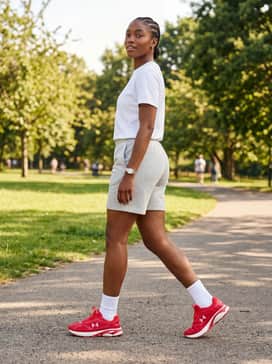 Light grey jersey shorts matched with a crisp white t-shirt and white crew socks for a classic, 90s-inspired athletic aesthetic.