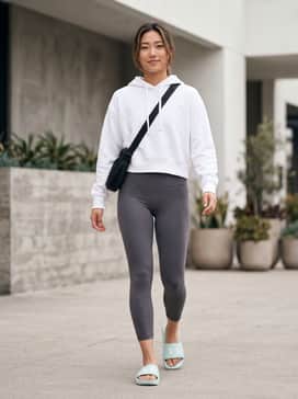 Ua Armr – Pair with high-waisted performance leggings and a white cropped hoodie for a sleek, post-gym aesthetic.