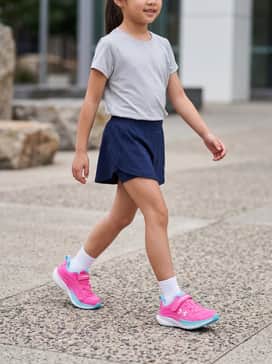 A light grey moisture-wicking t-shirt paired with navy blue athletic shorts and white ankle socks for a classic gym-ready look.
