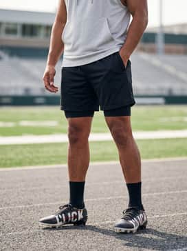 For intense off-season drills, pair with black 5-inch inseam mesh shorts and a light grey sleeveless performance hoodie.