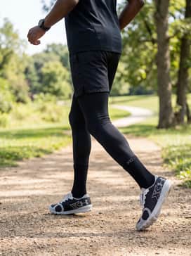 High-performance track socks in a stark white or black paired with a sleek athletic jersey for a unified, competitive race-day look.