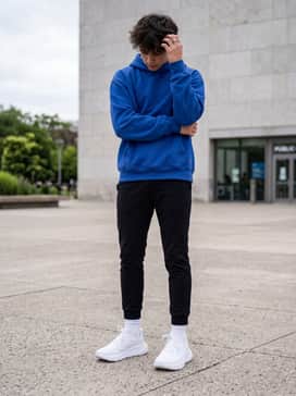 For a comfortable weekend vibe, wear them with tapered black joggers and a bright cobalt blue oversized hoodie for a bold pop of color.