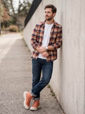 Rugged Weekend: Wear with dark wash indigo denim cuffed at the ankle, a white heavyweight pocket tee, and an unbuttoned burnt orange and navy plaid flannel shirt.