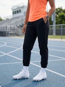 High-performance black compression leggings paired with a neon-colored moisture-wicking racerback tank top to create a high-contrast look for intensive practice sessions.