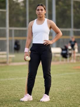 Intense Practice Session: Match with black high-waisted compression leggings and a breathable white racerback tank top, adding a pink sweatband for a coordinated touch.