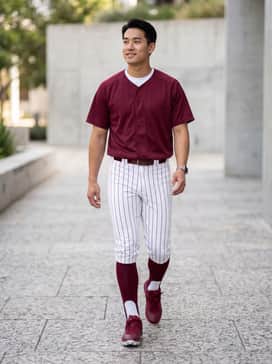 Full baseball uniform with grey pinstripe pants, a maroon performance jersey, and matching high-performance stirrup socks.