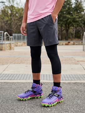 Dynamic Training Outfit: Wear with black moisture-wicking compression tights under charcoal grey athletic shorts and a lightweight pink tech-fabric tee.