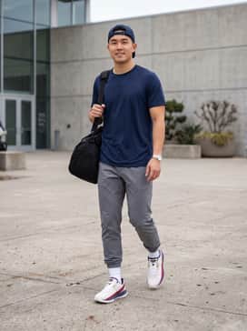 Ua Harper 10 Pro Turf Le Usa – A performance-focused look featuring a navy blue moisture-wicking team jersey paired with tapered grey athletic joggers and white crew socks, perfect for pre-game warmups.