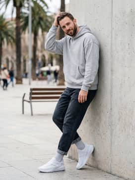 Wear with dark-wash tapered denim jeans and a light grey oversized hoodie to create a cohesive, street-inspired monochromatic aesthetic.