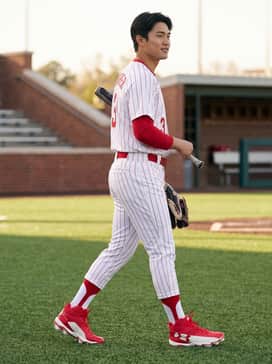 Ua Harper 10 Rm – A full team uniform featuring white pinstripe baseball pants, a matching red belt, and a moisture-wicking jersey.