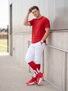 Ua Harper 10 Rm – Traditional white baseball knickers pulled high with red stirrups to emphasize the high-top silhouette of the cleat.