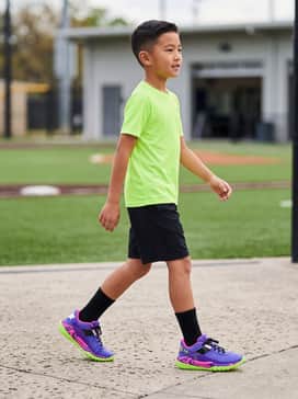 Pair with black moisture-wicking athletic shorts and a lime green performance tee to highlight the shoe's neon sole.