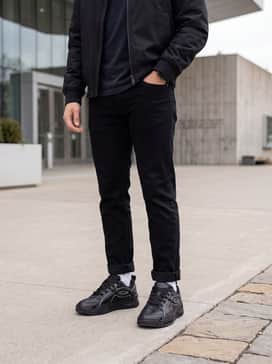 Ua Hblo – A clean minimalist aesthetic pairing slim-fit black denim jeans with a high-quality white heavyweight T-shirt and a cropped black bomber jacket for a sleek silhouette.