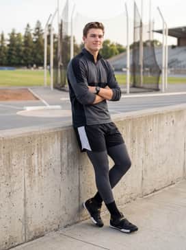 High-performance athletic compression leggings paired with a breathable, fitted quarter-zip training pullover.