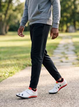 Post-meet relaxation ensemble including an oversized grey athletic hoodie and black joggers, ideal for transitioning from the pit to the sidelines while maintaining an athletic aesthetic.