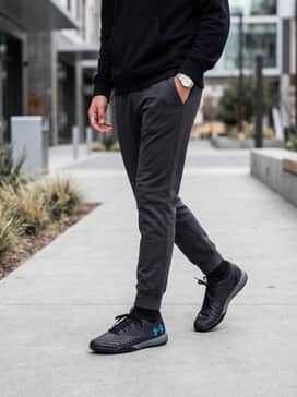 Match with charcoal tapered jeans, a black oversized graphic hoodie, and a minimalist baseball cap for a street-ready look.