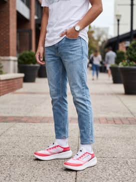 Style with tapered light-wash denim jeans and a simple white graphic tee to let the vibrant shoe colors pop.