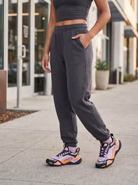 Ua Reign Xt – Pair with charcoal grey oversized joggers and a fitted neon orange crop top to echo the shoe's vibrant accents for a modern streetwear aesthetic.