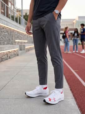 Ua Shakedown Elite 3 – A lightweight, moisture-wicking quarter-zip pullover worn with tapered performance joggers during pre-race warm-ups and drills.