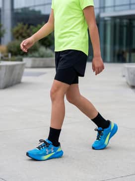 Ua Velociti Pace – Athletic Performance: Pair these with black compression shorts and a moisture-wicking neon lime t-shirt that echoes the shoe's vibrant accents for a high-energy look.