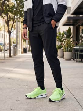 Athleisure-inspired casual wear: Combine the shoes with tapered black joggers and an oversized white hoodie to let the vibrant green color pop as a statement piece.
