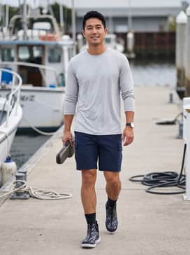 Ua X Blacktiph Charged Shoreman – Performance fishing gear: Pair these boots with navy blue quick-dry cargo shorts and a light grey long-sleeve moisture-wicking sun shirt for a functional day on the boat.