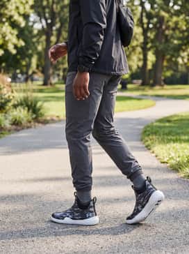 Ua X Blacktiph Charged Shoreman – Rainy Day Utility: Match with charcoal grey ripstop trousers and a lightweight black waterproof shell jacket for a cohesive, weather-ready outfit.