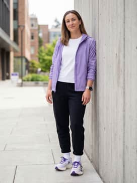 Black tech-fleece joggers and a simple white crewneck t-shirt topped with a lightweight lavender windbreaker to draw attention to the shoe's vibrant accents.