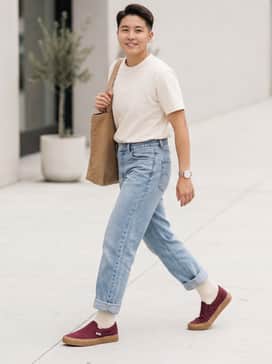 Pair with light-wash relaxed straight-leg jeans, a tucked-in cream-colored graphic tee, and a tan canvas tote bag for a classic street-ready look.