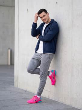 Vapor 12 Hypersmash – A sleek casual outfit pairing tapered grey marl joggers with a fitted navy blue windbreaker and a simple white cotton t-shirt for a balanced athletic aesthetic.