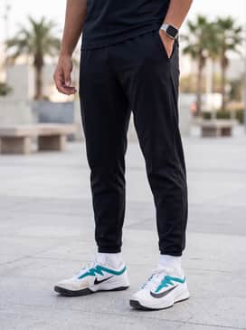 Vapor Pro 3 – A sleek training outfit consisting of black tapered joggers, a fitted light grey tech-fleece hoodie, and a matching teal sports headband.