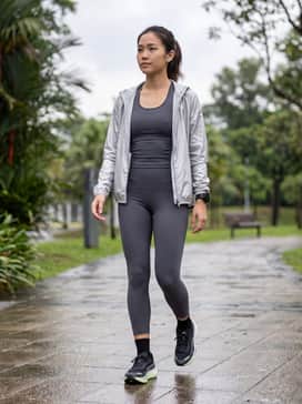 Velocity Nitro 3 Goretex Womens Running Shoes – High-waisted charcoal grey compression leggings paired with a matching moisture-wicking racerback tank and a reflective silver windbreaker for early morning runs.
