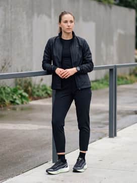 Velocity Nitro 3 Goretex Womens Running Shoes – Tapered black athletic joggers and a fitted GORE-TEX technical shell jacket for a sleek, weather-resistant outdoor training look.