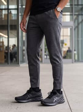 Versablast 4 Wide – Urban streetwear: Tapered black joggers and a crisp, oversized white heavyweight cotton t-shirt, topped with a charcoal grey bomber jacket for a sleek, monochromatic aesthetic.