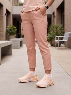 Light-wash distressed denim overalls worn over a simple white short-sleeved cotton tee for a comfortable yet stylish playground look.