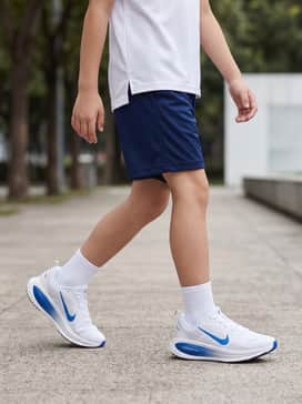 Pair these sneakers with navy blue mesh athletic shorts and a white moisture-wicking t-shirt for a high-performance running outfit.