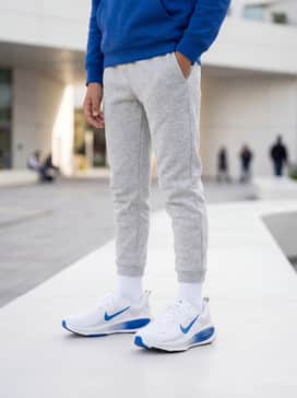 Combine with light grey fleece joggers and a matching royal blue hoodie for a cohesive and comfortable weekend leisure look.