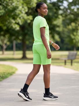 Vomero 18 – An active summer style pairing breathable mesh shorts in a vibrant neon green with a matching lightweight jersey for maximum comfort on the move.