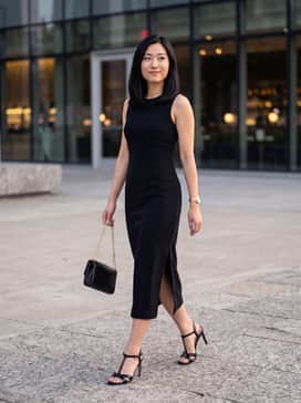 Womens Constantina Sandals – A sleek black midi dress with a side slit and a gold chain clutch for a sophisticated formal evening look.