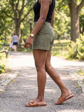 Womens Goto Emalia Slide Bow Sandals – Olive green utility shorts paired with a tucked-in black ribbed tank top and oversized sunglasses for an effortlessly cool summer aesthetic.
