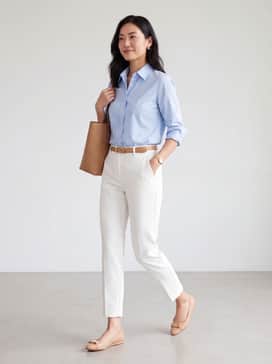 Womens Goto Tova Bow Ballet Flats – Tailored white ankle-length trousers paired with a crisp light blue button-down shirt and minimalist gold jewelry for a polished office ensemble.