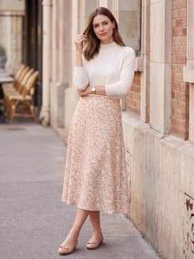 Womens Goto Tova Bow Ballet Flats – A floral-print midi skirt in pastel tones combined with a tucked-in ivory mock-neck sweater for a feminine weekend brunch outfit.