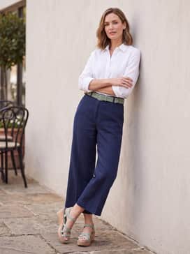 Womens Grand Ambition Azzura Strappy Wedge Sandal – High-waisted navy blue culottes and a crisp white button-down shirt tucked in, finished with a matching sage green belt.
